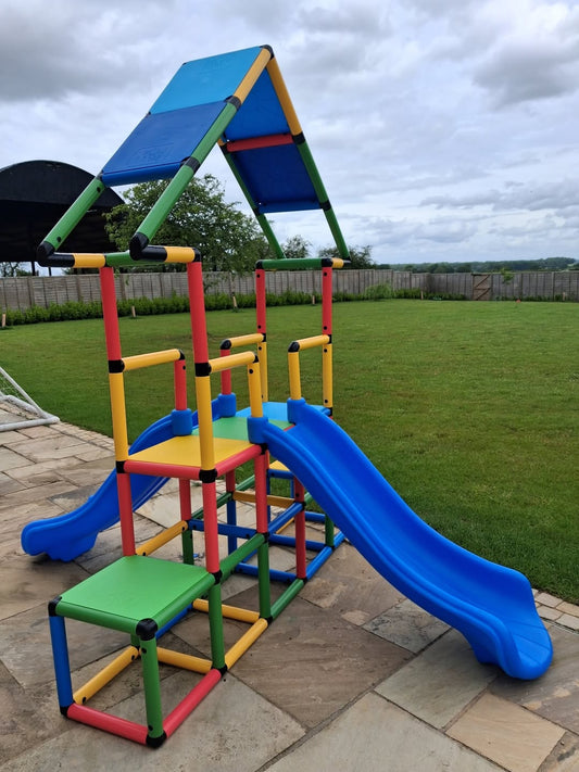 Customer built Funphix modular climbing frame with slide and roof panels in a garden