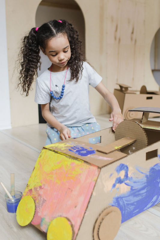 Child absorbed in imaginative play at home